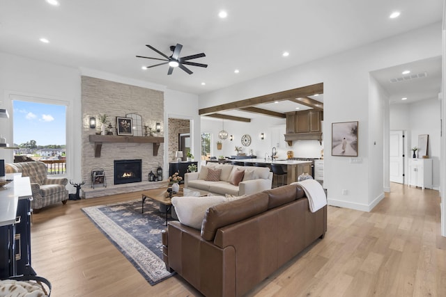 858 E Edenmore Cir, Nixa, MO 65714 - living area featuring a ceiling fan, a fireplace, light wood-style flooring, recessed lighting, and beam ceiling
