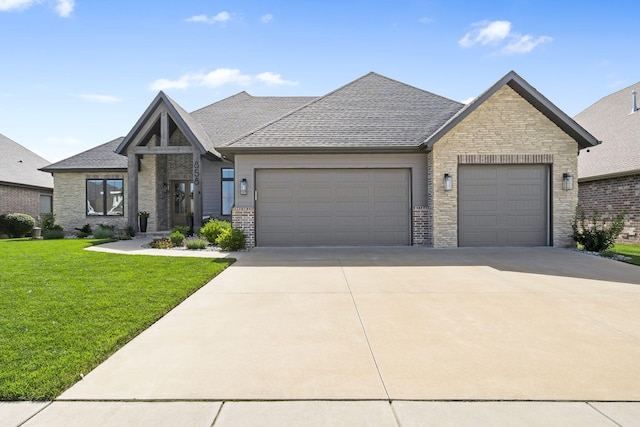 858 E Edenmore Cir, Nixa, MO 65714 - view of front of home with an attached garage, a front yard, driveway, stone siding, and roof with shingles