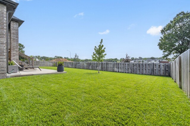 858 E Edenmore Cir, Nixa, MO 65714 - fenced backyard with a patio area