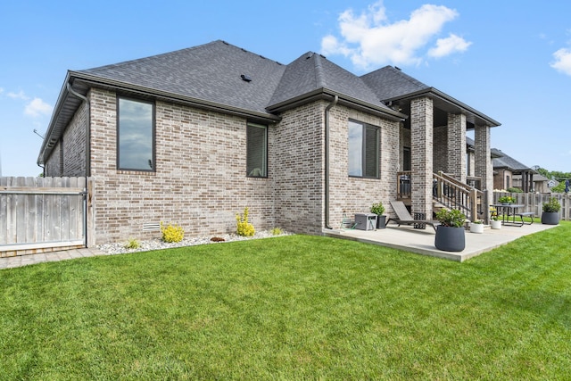858 E Edenmore Cir, Nixa, MO 65714 - back of house featuring brick siding, a patio, and a shingled roof