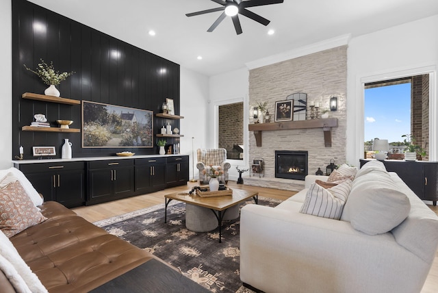 858 E Edenmore Cir, Nixa, MO 65714 - living area featuring ceiling fan, light wood-style flooring, a stone fireplace, and recessed lighting
