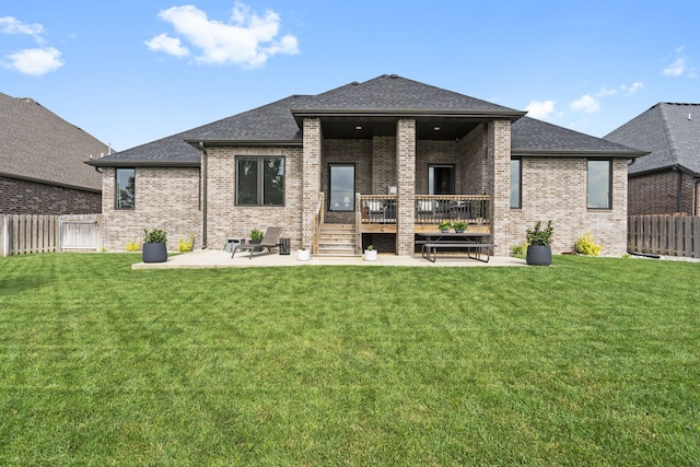 858 E Edenmore Cir, Nixa, MO 65714 - rear view of property featuring a patio area, brick siding, a fenced backyard, roof with shingles, and a wooden deck