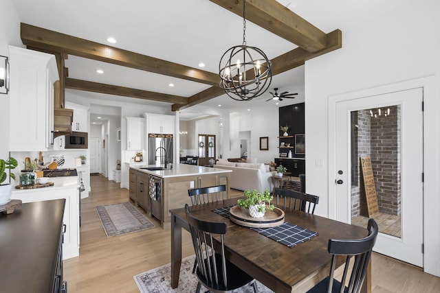858 E Edenmore Cir, Nixa, MO 65714 - dining room featuring light wood-type flooring, a chandelier, beamed ceiling, recessed lighting, and a ceiling fan