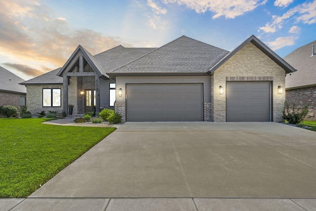 858 E Edenmore Cir, Nixa, MO 65714 - view of front of home with a garage, concrete driveway, a front lawn, and stone siding