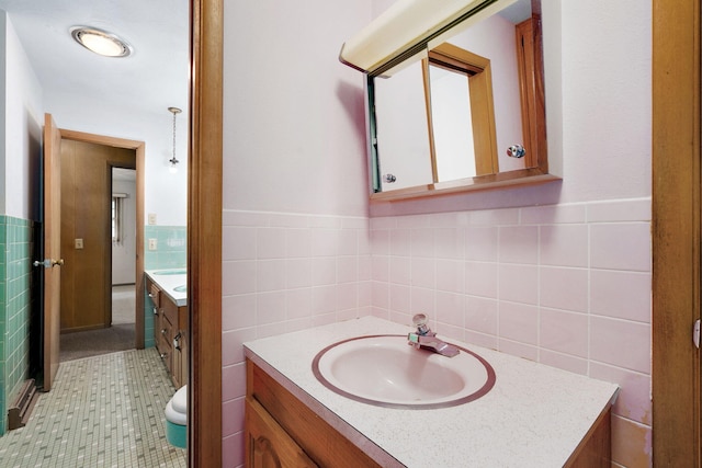 3066 E Lomita St, Springfield, MO 65804 - bathroom featuring vanity, tile walls, and a wainscoted wall