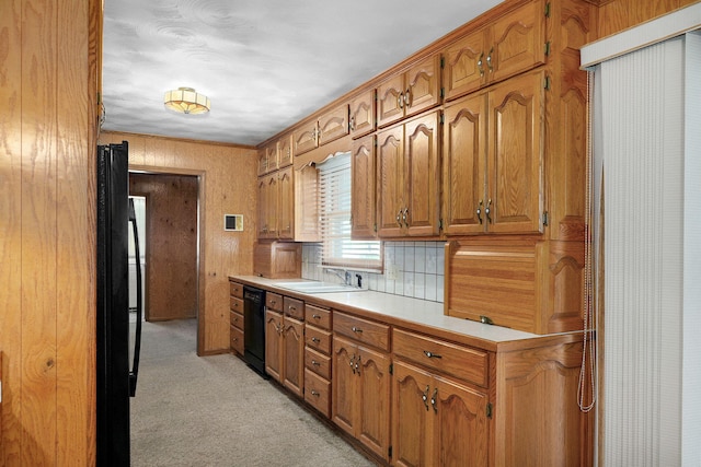 3066 E Lomita St, Springfield, MO 65804 - kitchen with black appliances, light countertops, brown cabinets, and light colored carpet