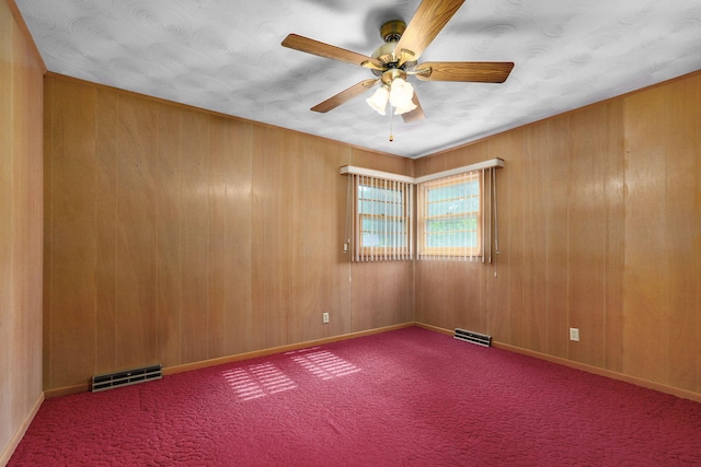 3066 E Lomita St, Springfield, MO 65804 - carpeted empty room featuring ceiling fan and wood walls