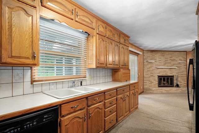3066 E Lomita St, Springfield, MO 65804 - kitchen with dishwasher, refrigerator, light carpet, light countertops, and brick wall