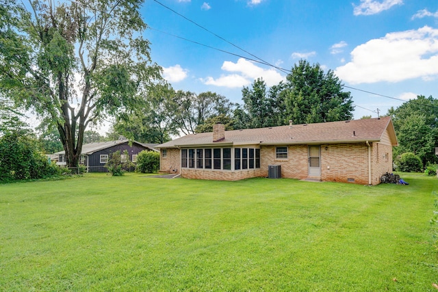 3066 E Lomita St, Springfield, MO 65804 - rear view of property with brick siding, a yard, and a chimney