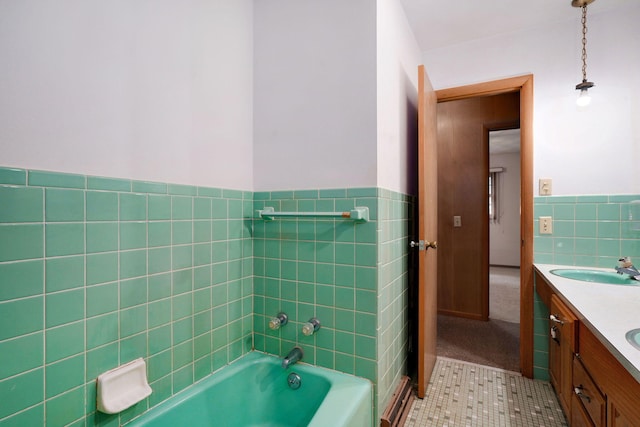 3066 E Lomita St, Springfield, MO 65804 - full bath with tile walls, tile patterned floors, double vanity, a tub, and a wainscoted wall