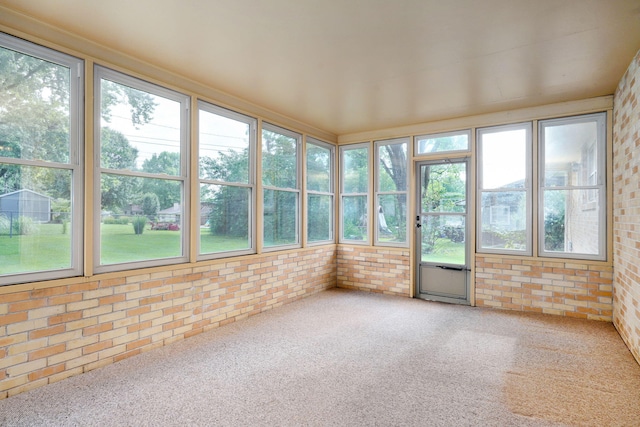3066 E Lomita St, Springfield, MO 65804 - unfurnished sunroom featuring brick wall and carpet