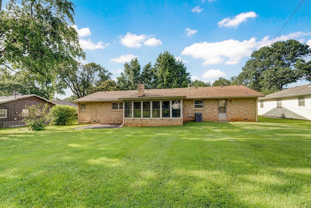 3066 E Lomita St, Springfield, MO 65804 - back of property with brick siding, a lawn, and a chimney