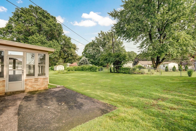 3066 E Lomita St, Springfield, MO 65804 - view of yard with a patio and a storage unit