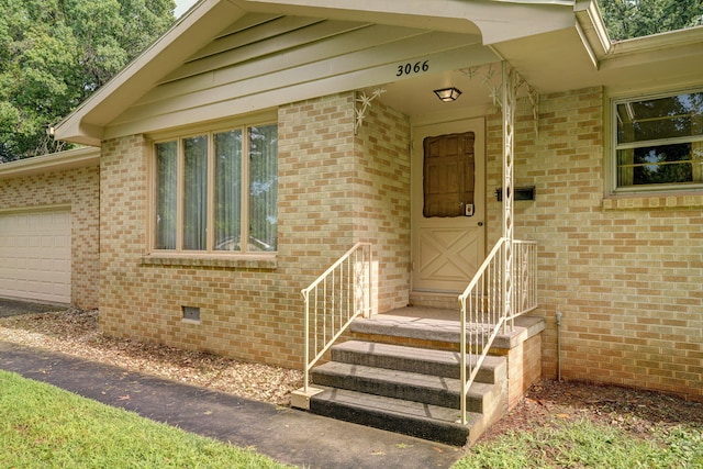 3066 E Lomita St, Springfield, MO 65804 - doorway to property with brick siding, a garage, and crawl space