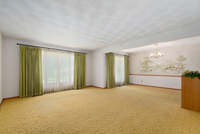 3066 E Lomita St, Springfield, MO 65804 - spare room with a chandelier and carpet flooring