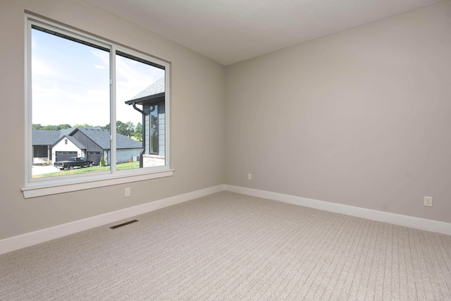 6059 S Clay Ave, Springfield, MO 65810 - spare room featuring carpet floors and baseboards