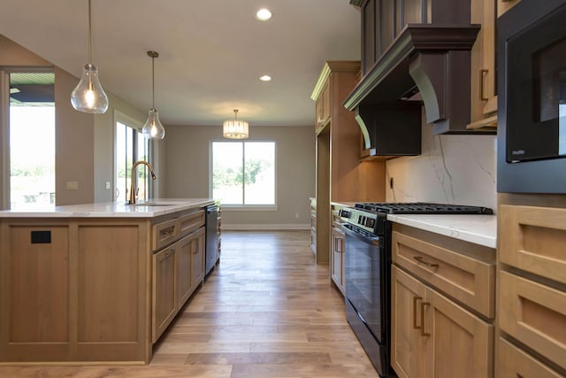 6059 S Clay Ave, Springfield, MO 65810 - kitchen with gas stove, light wood-type flooring, tasteful backsplash, recessed lighting, and light stone countertops