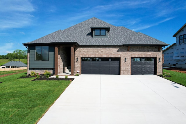 6059 S Clay Ave, Springfield, MO 65810 - view of front of house with brick siding, a garage, a front lawn, concrete driveway, and a shingled roof