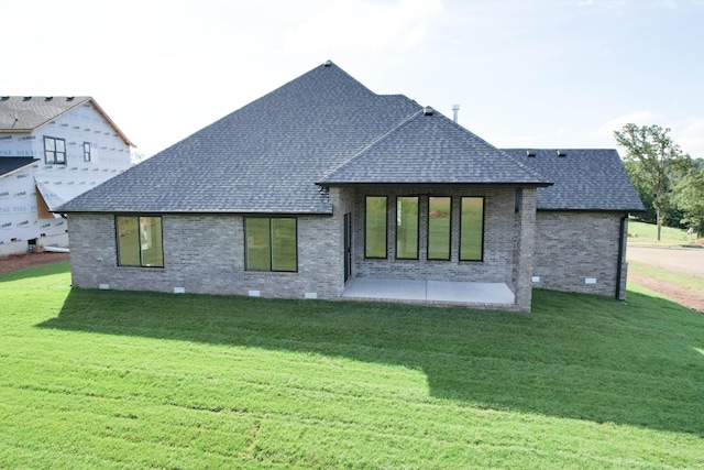 6059 S Clay Ave, Springfield, MO 65810 - rear view of house featuring roof with shingles, a patio area, brick siding, crawl space, and a lawn