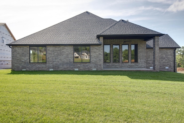 6059 S Clay Ave, Springfield, MO 65810 - rear view of house with roof with shingles, brick siding, crawl space, and a yard