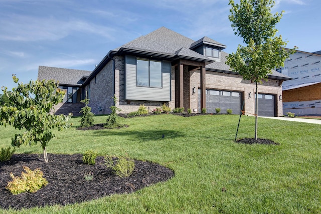 6059 S Clay Ave, Springfield, MO 65810 - view of front of property with concrete driveway, brick siding, a front yard, a garage, and roof with shingles