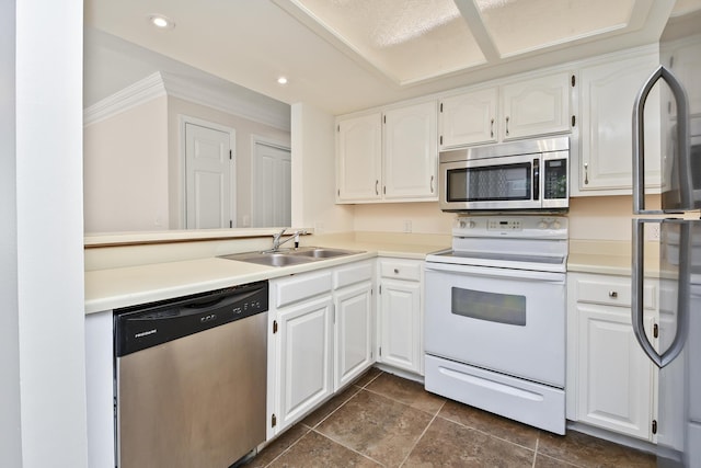 3440 S Delaware Ave Unit 114, Springfield, MO 65804 - kitchen featuring appliances with stainless steel finishes, white cabinetry, light countertops, dark tile patterned floors, and recessed lighting