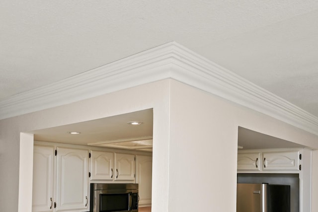 3440 S Delaware Ave Unit 114, Springfield, MO 65804 - detailed view of stainless steel appliances, crown molding, and recessed lighting