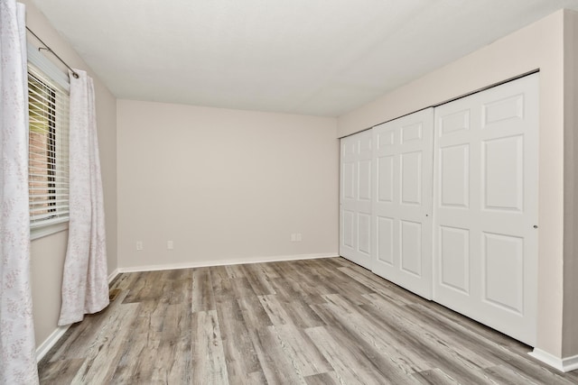 3440 S Delaware Ave Unit 114, Springfield, MO 65804 - unfurnished bedroom with wood finished floors and a closet