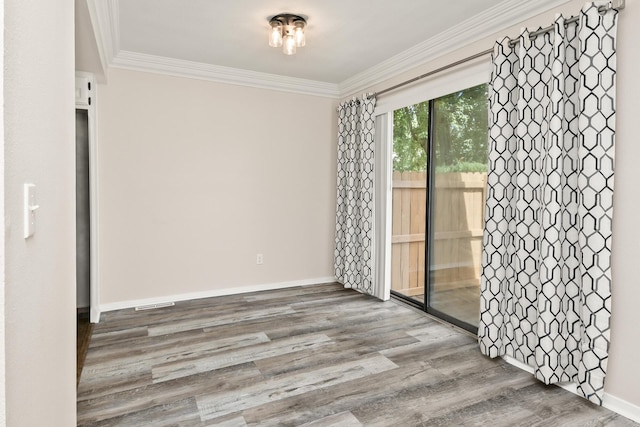 3440 S Delaware Ave Unit 114, Springfield, MO 65804 - spare room featuring wood finished floors and crown molding