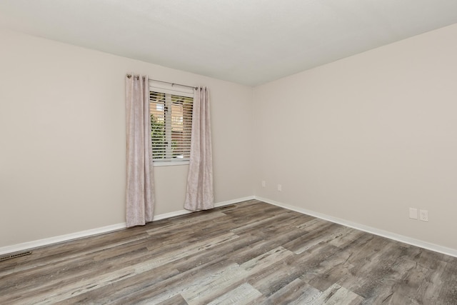 3440 S Delaware Ave Unit 114, Springfield, MO 65804 - empty room with wood finished floors