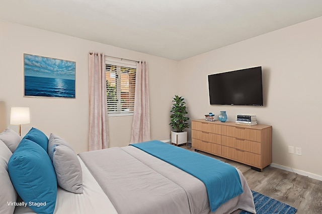 3440 S Delaware Ave Unit 114, Springfield, MO 65804 - bedroom featuring light wood-style flooring and baseboards