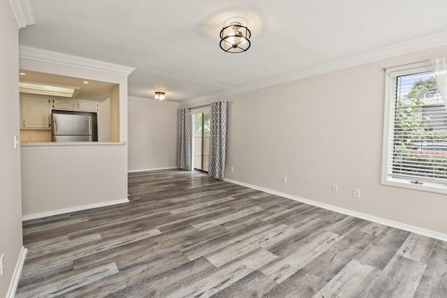 3440 S Delaware Ave Unit 114, Springfield, MO 65804 - unfurnished living room featuring crown molding and dark wood-type flooring