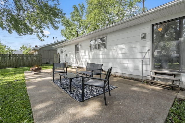 2558 S Nettleton Ave, Springfield, MO 65807 - view of patio / terrace featuring entry steps and an outdoor living space with a fire pit
