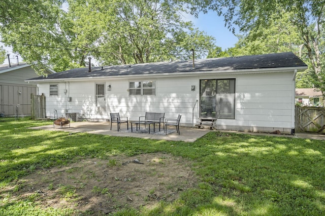 2558 S Nettleton Ave, Springfield, MO 65807 - rear view of property featuring a patio, an outdoor fire pit, and entry steps