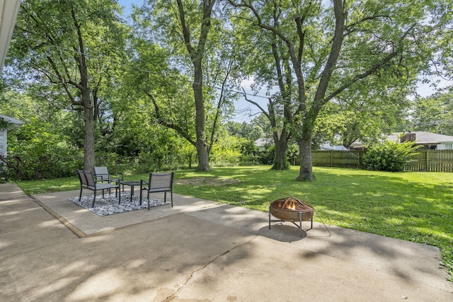 2558 S Nettleton Ave, Springfield, MO 65807 - fenced backyard featuring a fire pit and a patio area