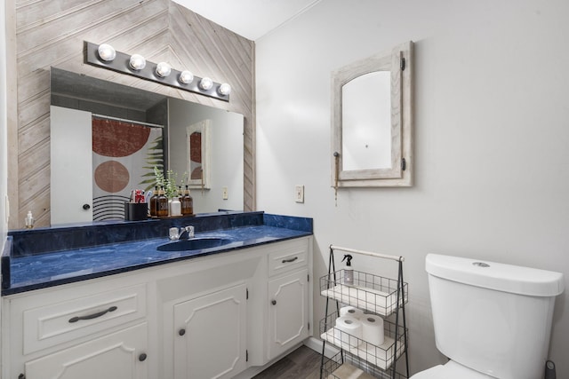 2558 S Nettleton Ave, Springfield, MO 65807 - full bathroom featuring vanity and wood finished floors