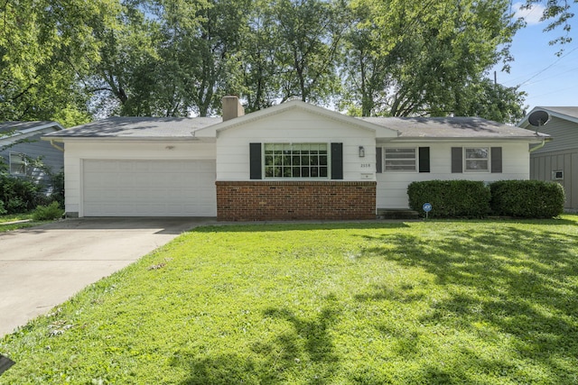 2558 S Nettleton Ave, Springfield, MO 65807 - ranch-style home with an attached garage, a front yard, concrete driveway, and a chimney
