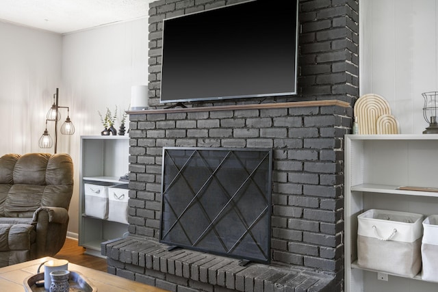 2558 S Nettleton Ave, Springfield, MO 65807 - living room with a brick fireplace and wood finished floors