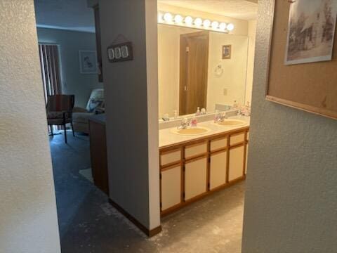 3 Memory Ln Unit 1, Branson, MO 65616 - bathroom featuring double vanity and a textured wall