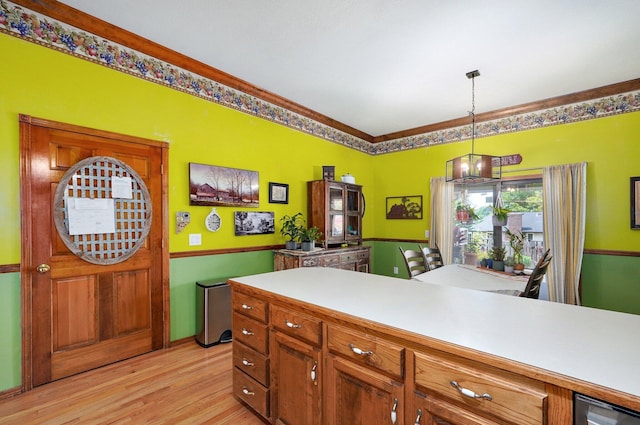 311 Northview Rd, Nixa, MO 65714 - kitchen with light wood finished floors, pendant lighting, light countertops, and brown cabinets