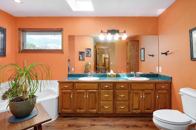 311 Northview Rd, Nixa, MO 65714 - full bathroom featuring double vanity and wood finished floors