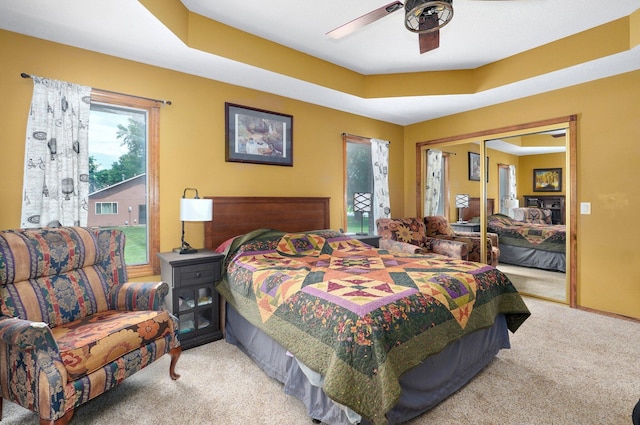 311 Northview Rd, Nixa, MO 65714 - carpeted bedroom featuring a closet, ceiling fan, and a tray ceiling