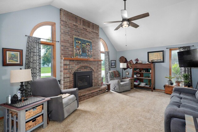 311 Northview Rd, Nixa, MO 65714 - living area with ceiling fan, a brick fireplace, plenty of natural light, carpet flooring, and high vaulted ceiling