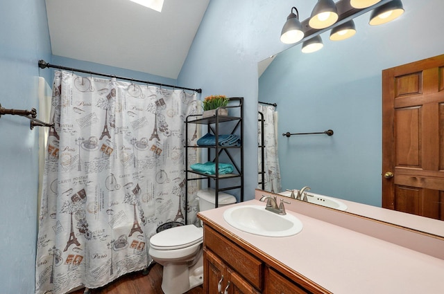 311 Northview Rd, Nixa, MO 65714 - full bathroom featuring vanity, wood finished floors, vaulted ceiling, and a shower with shower curtain