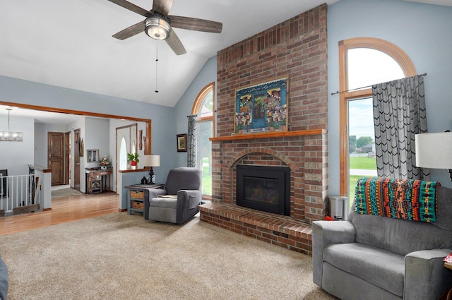 311 Northview Rd, Nixa, MO 65714 - carpeted living area featuring a ceiling fan, a fireplace, and high vaulted ceiling