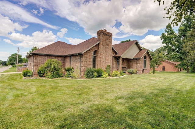 311 Northview Rd, Nixa, MO 65714 - view of front of house featuring brick siding, a shingled roof, and a chimney