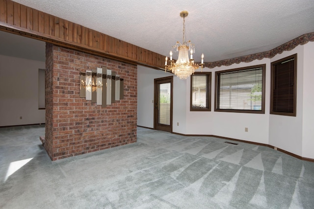 3501 E Cooper Blvd, Springfield, MO 65802 - carpeted spare room with a chandelier and a textured ceiling