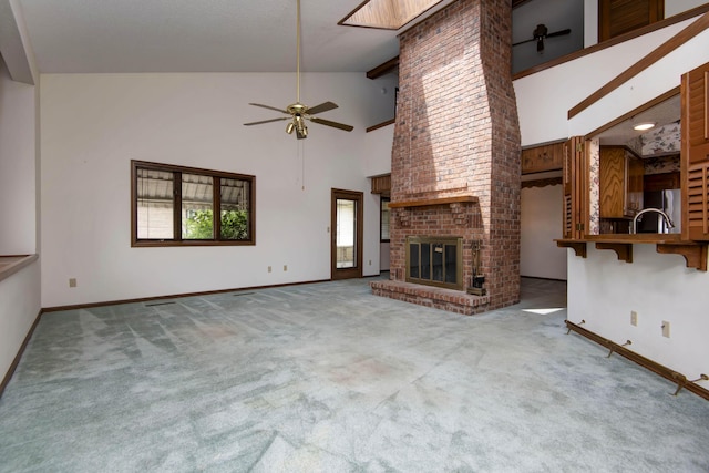 3501 E Cooper Blvd, Springfield, MO 65802 - unfurnished living room with a ceiling fan, carpet, a fireplace, and high vaulted ceiling