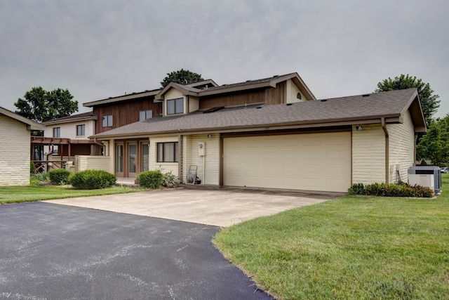 3501 E Cooper Blvd, Springfield, MO 65802 - view of property with driveway, a garage, a front lawn, and brick siding
