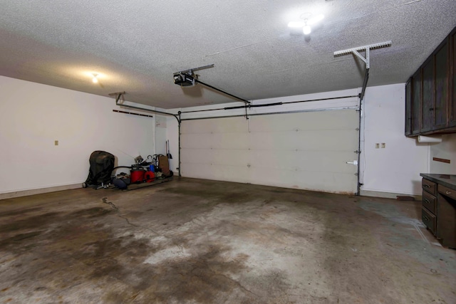3501 E Cooper Blvd, Springfield, MO 65802 - garage featuring a garage door opener